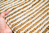 Detail shot of wool and jute fiber blend in ivory tone