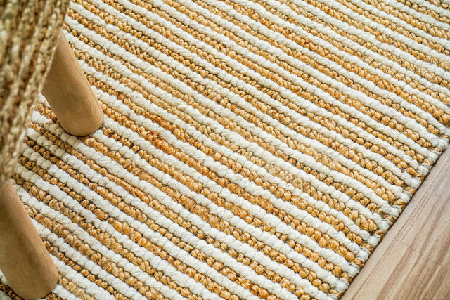 Natural ivory wool jute rug styled in a living room