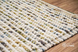 Pastel chunky wool loop rug flat lay showing colors