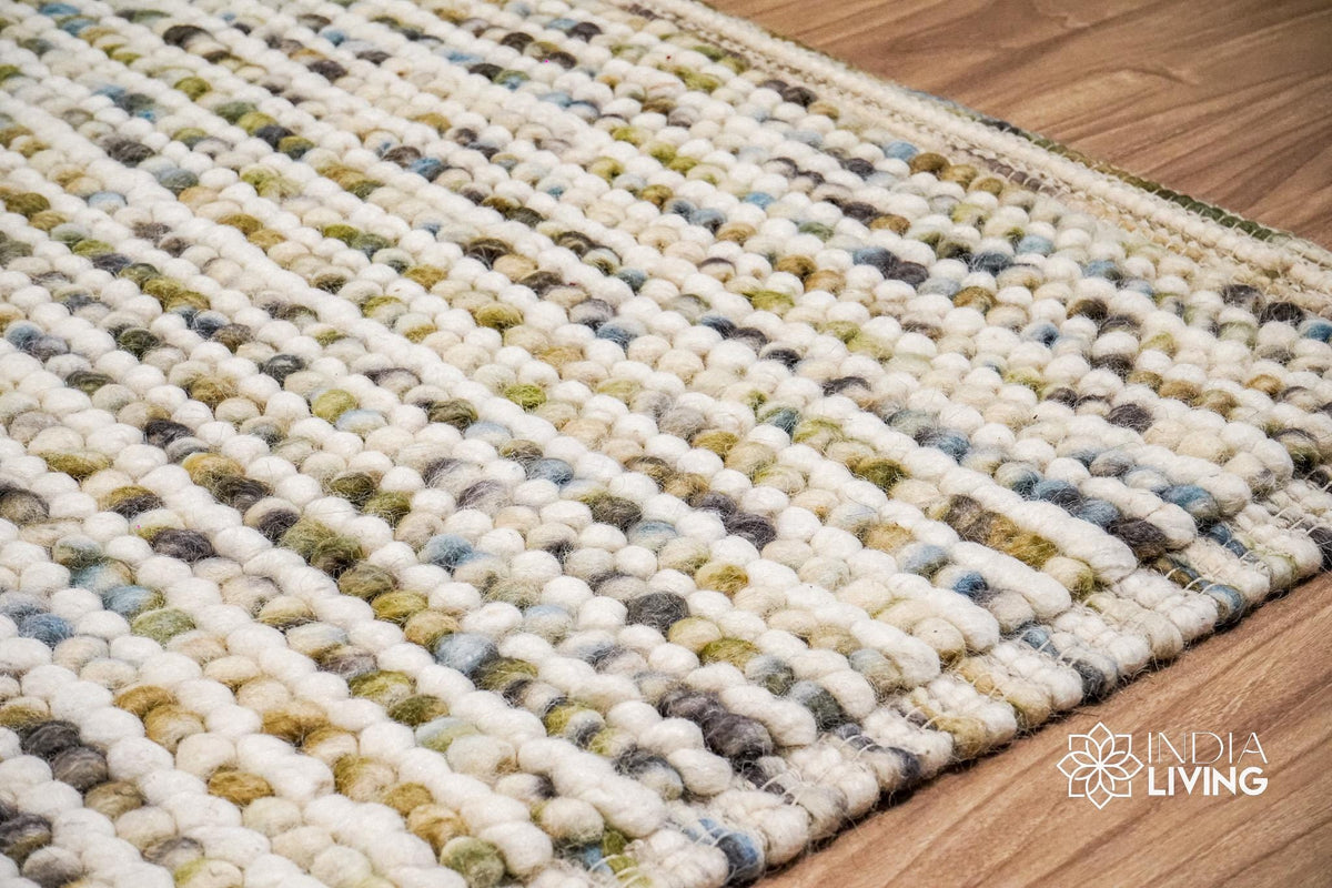 Pastel chunky wool loop rug flat lay showing colors