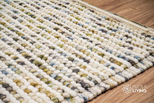 Pastel chunky wool loop rug flat lay showing colors