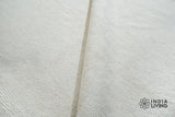 Ivory rug texture detail under natural light