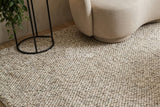 Cashew Loop — texture detail of the wool pile styled in a room setting