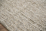 Cashew Loop wool rug — close-up of the woven pile surface and edge finish