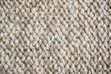 Cashew Loop wool rug — close-up of the handwoven pile and finished edge