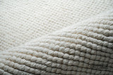 Handwoven wool rug in a nursery setting