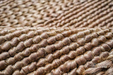 Handwoven jute rug full view on flooring