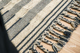 Wool kilim rug shown at full size on wood flooring