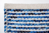 Wool rug corner detail with tonal colour movement