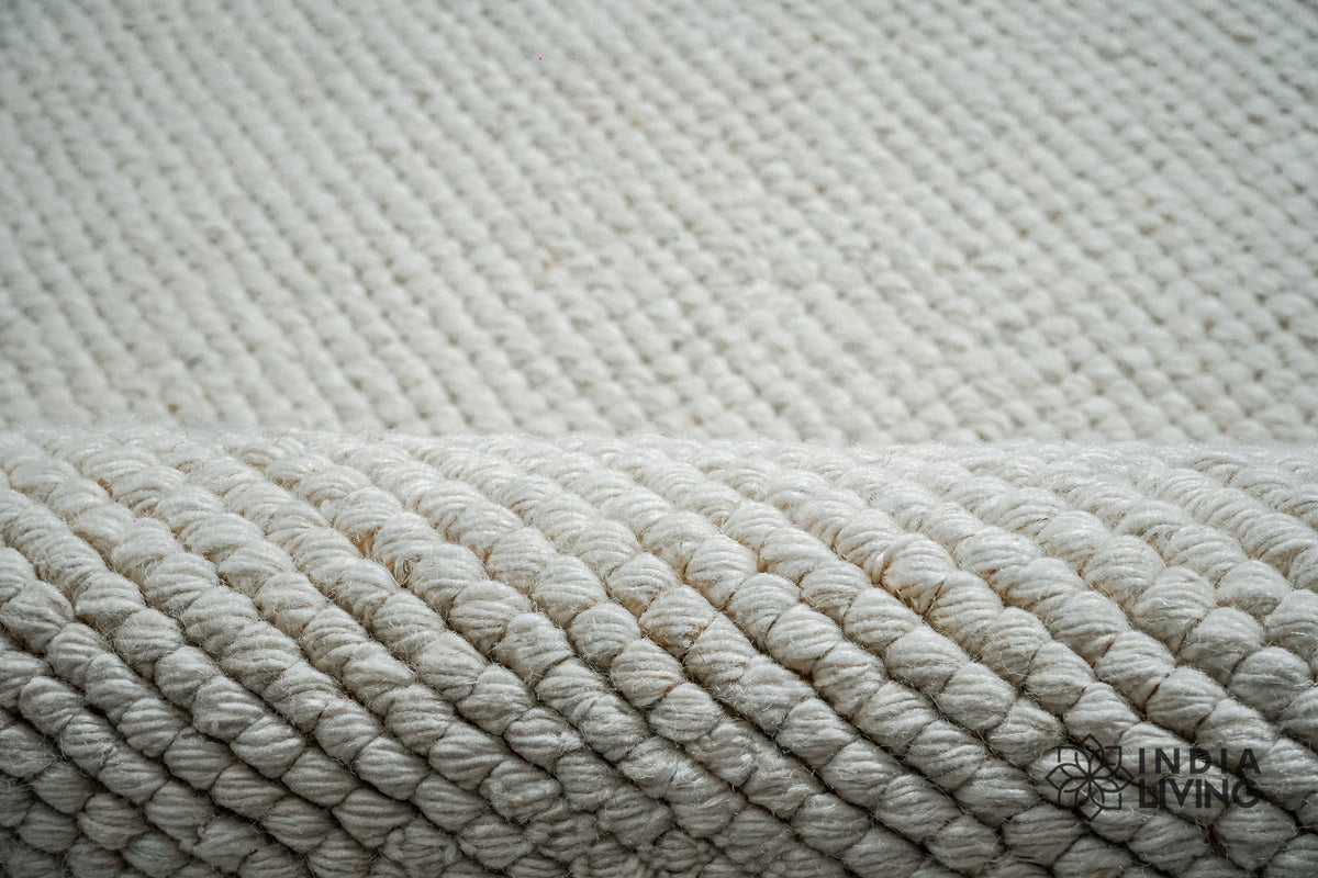 Wool rug corner detail showing loop pile