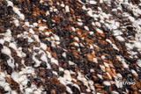 Handcarded wool rug shown at full size on wood flooring